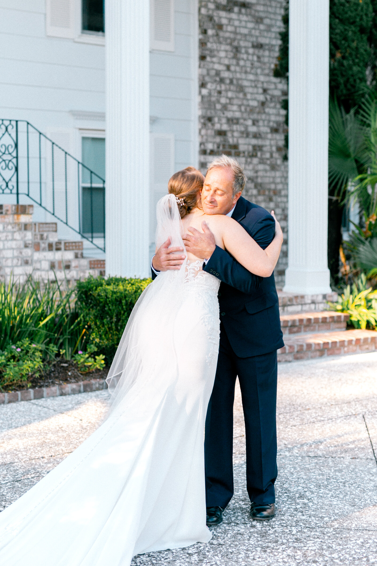 First look candid moment with the father of the bride at South Carolina wedding.