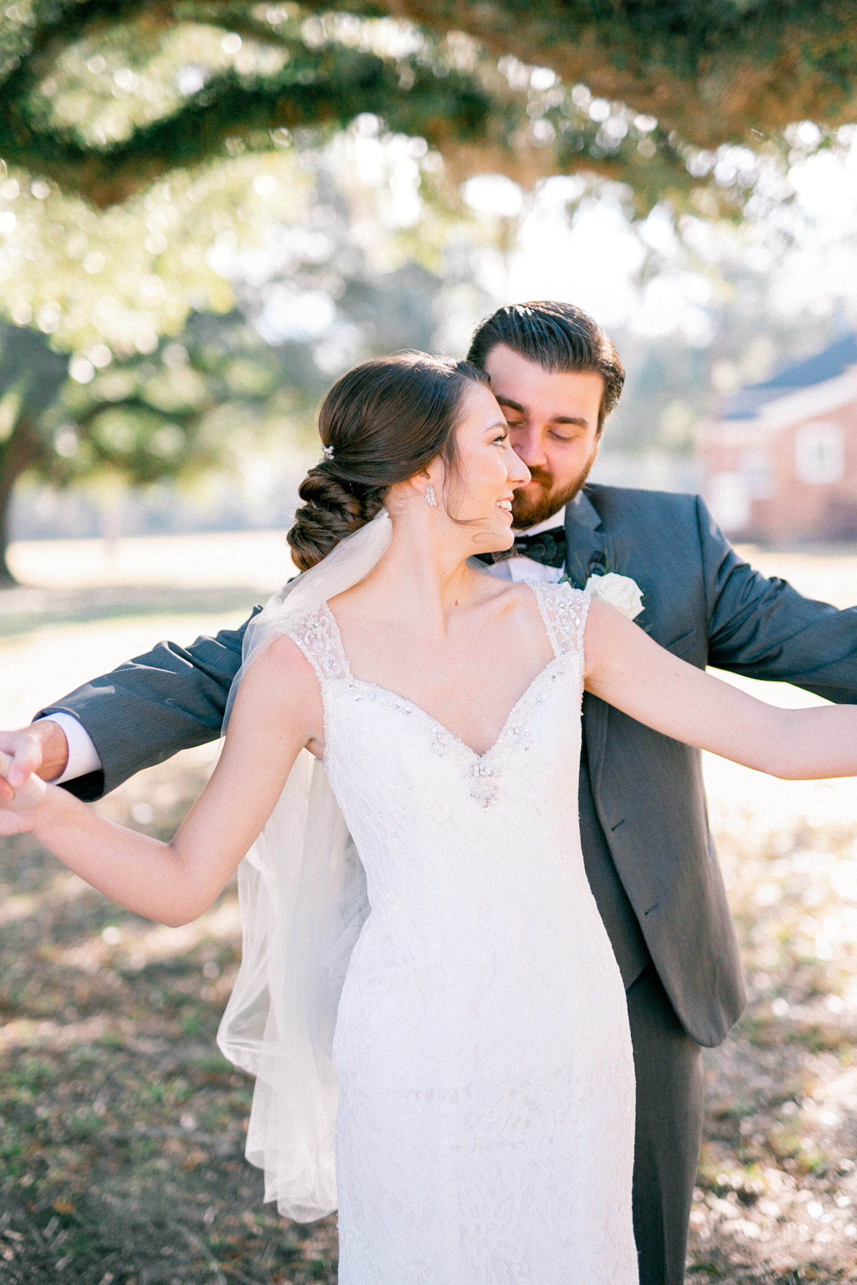 Bride and groom share candid moments before their wedding day in Charleston.