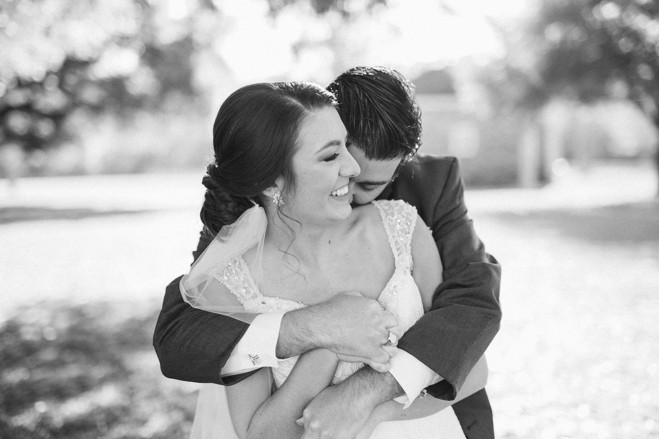 Bride and groom share a sweet, intimate moment in Charleston, South Carolina Christmas wedding.