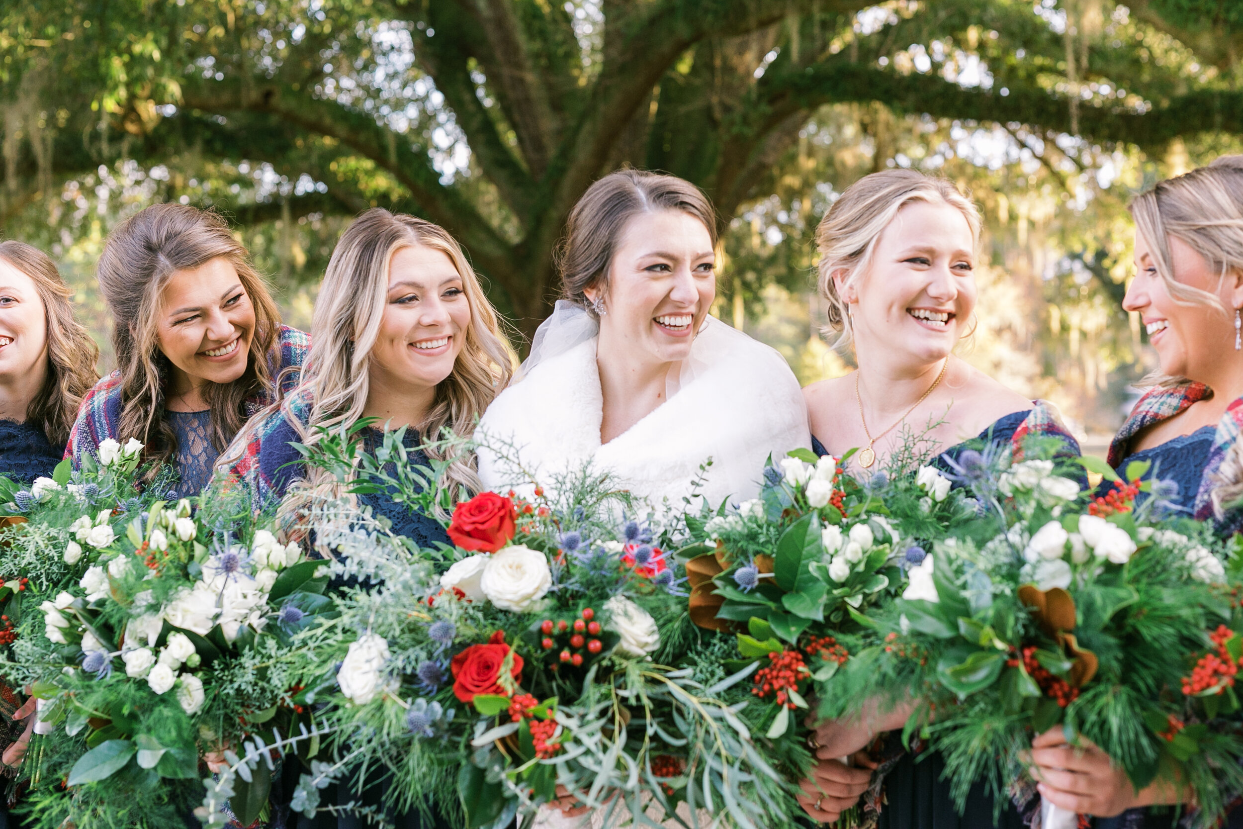 Candid portraits of bride and bridesmaids at high-end Charleston wedding.