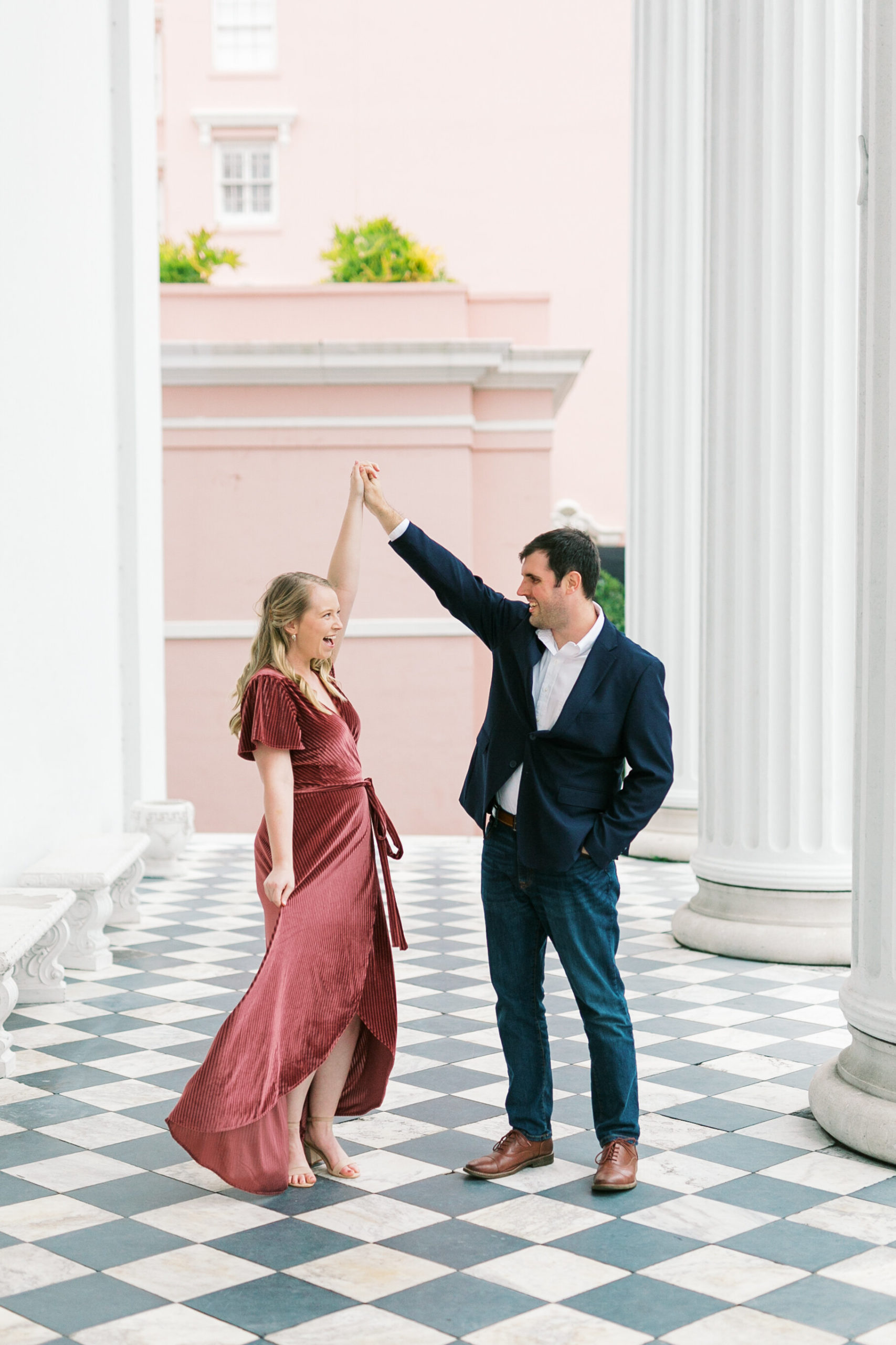 Cute engaged couple poses for their effortless engagement session in historic Charleston, SC.