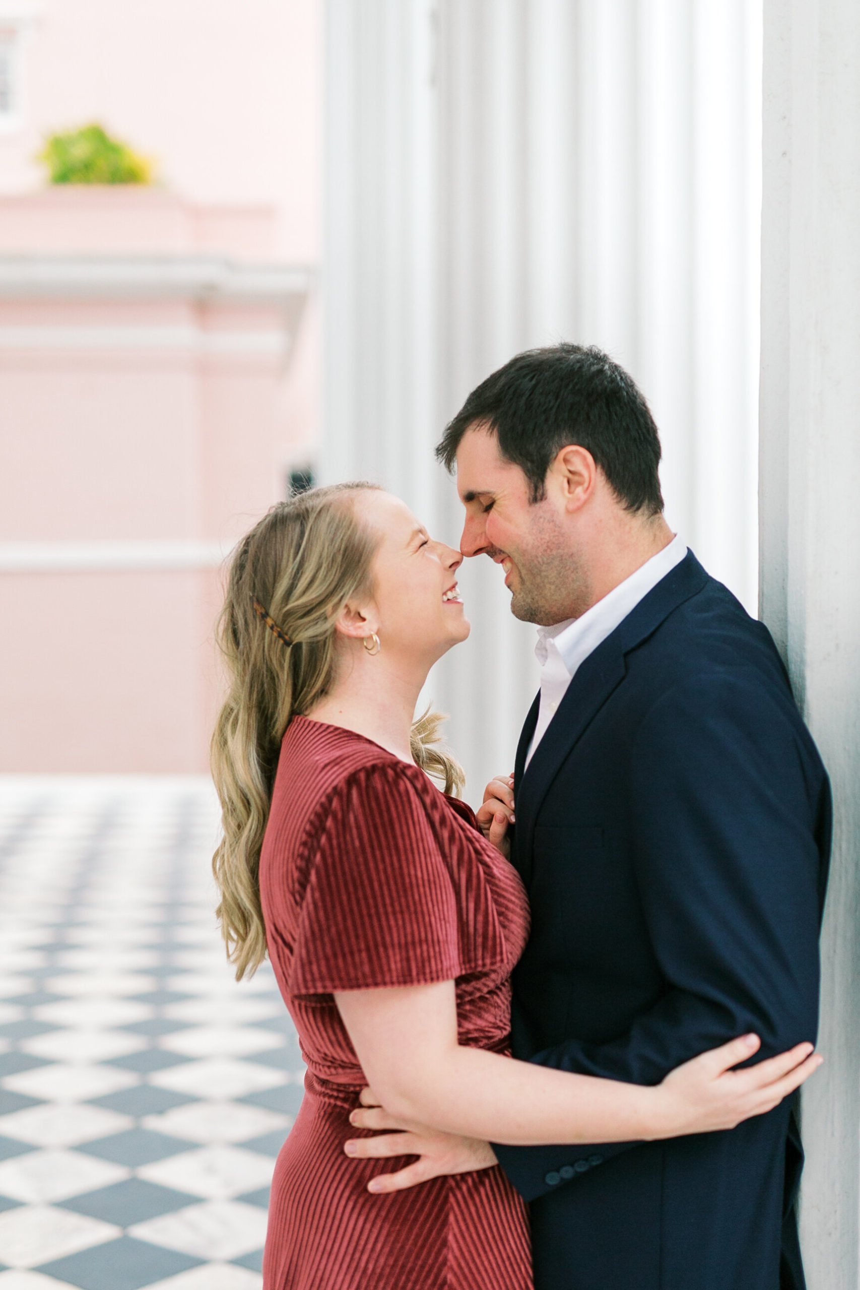 Adorable couple shares a sweet moment during their engagement photos in Charleston, South Carolina.