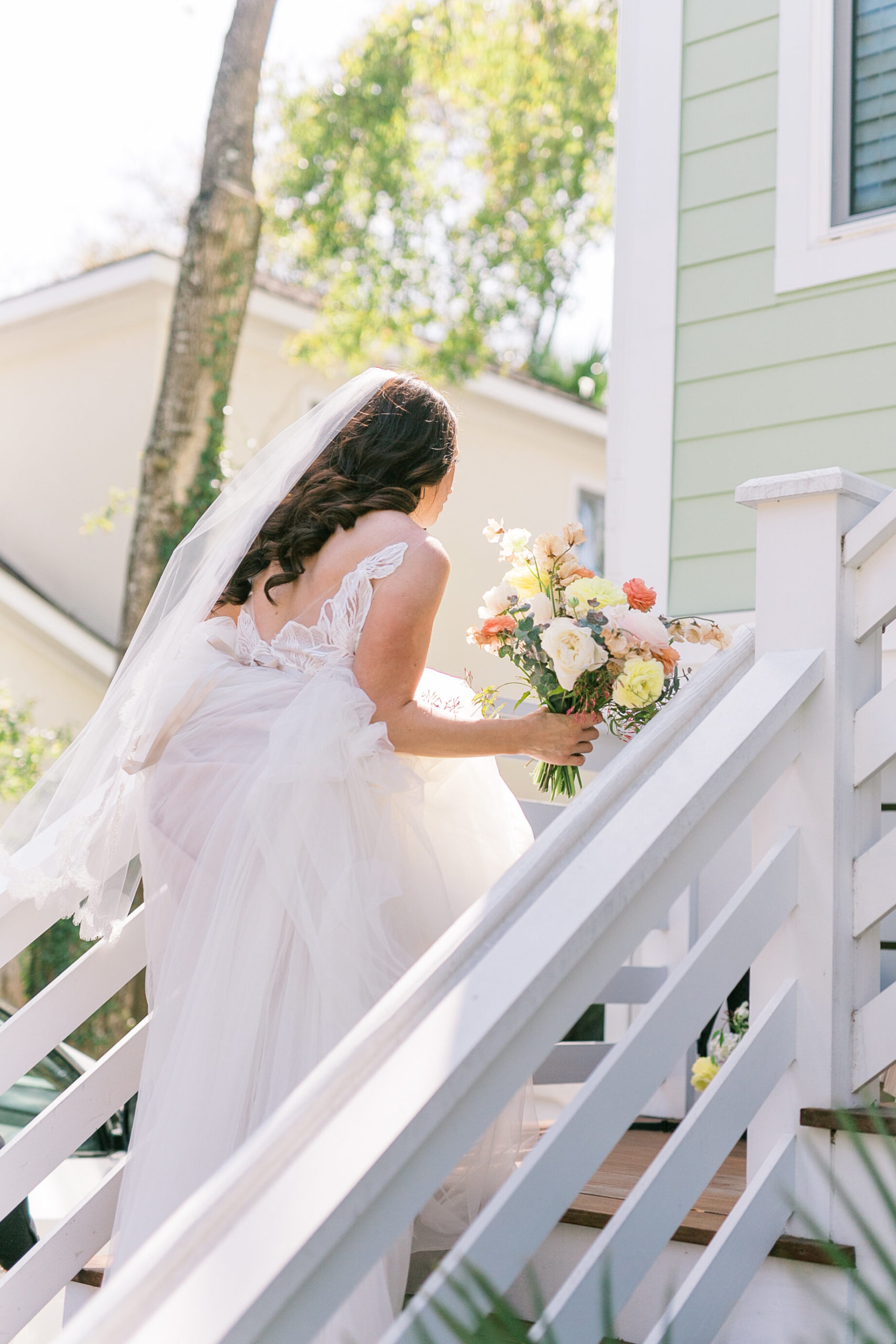 Beautiful bride shares a sweet moment in the sunlight