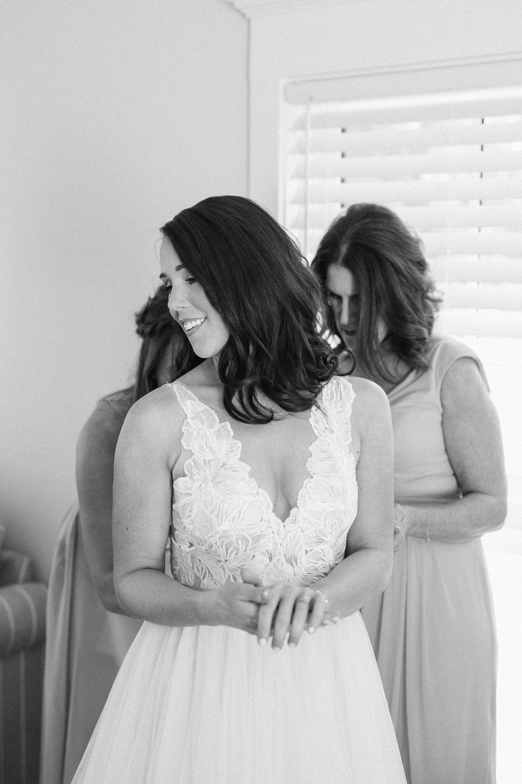 mother of the bride helps bride get ready for her Charleston wedding