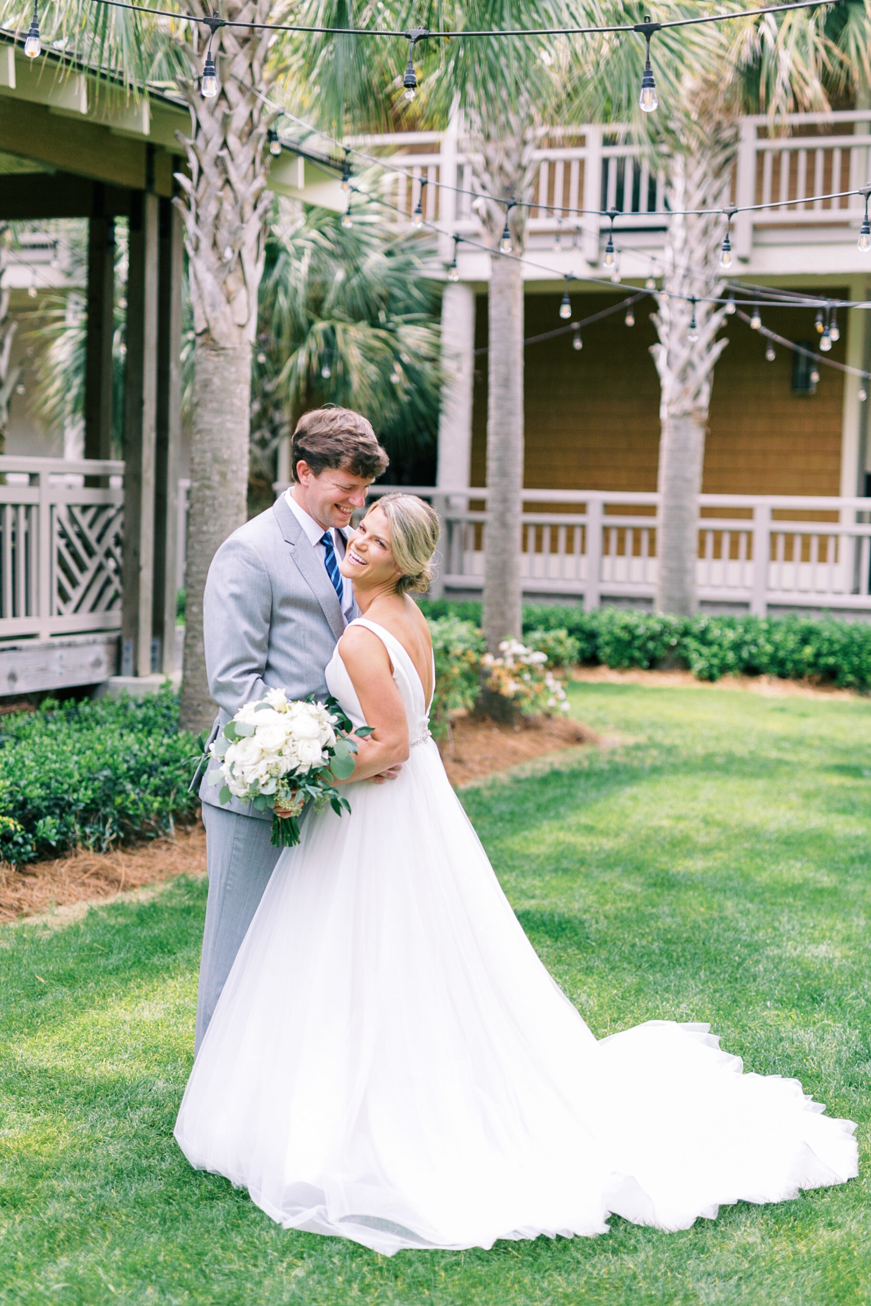 Attractive bride and groom laughing during their luxury Hilton Head Island wedding.