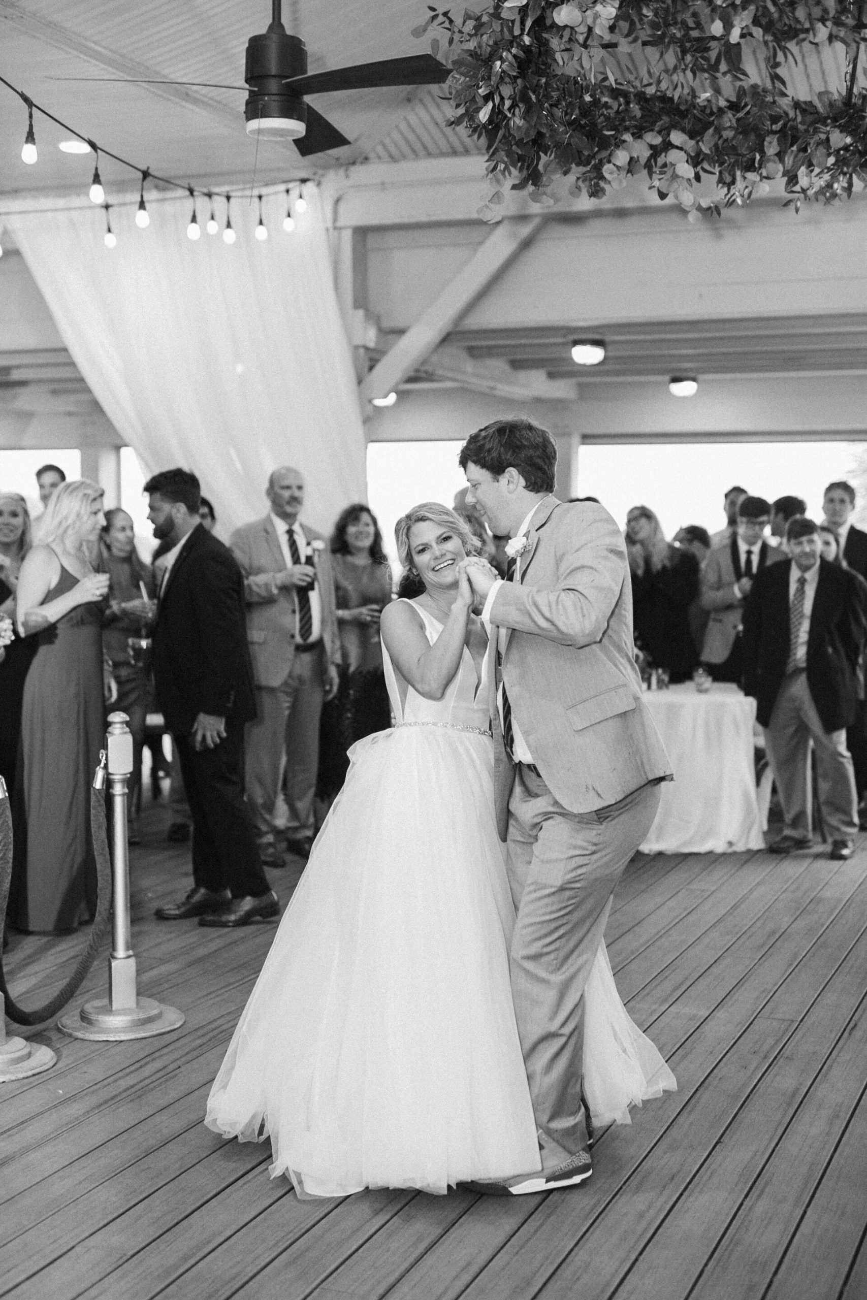 Bride and groom share first dance at Hilton Head Island, South Carolina oceanfront wedding.