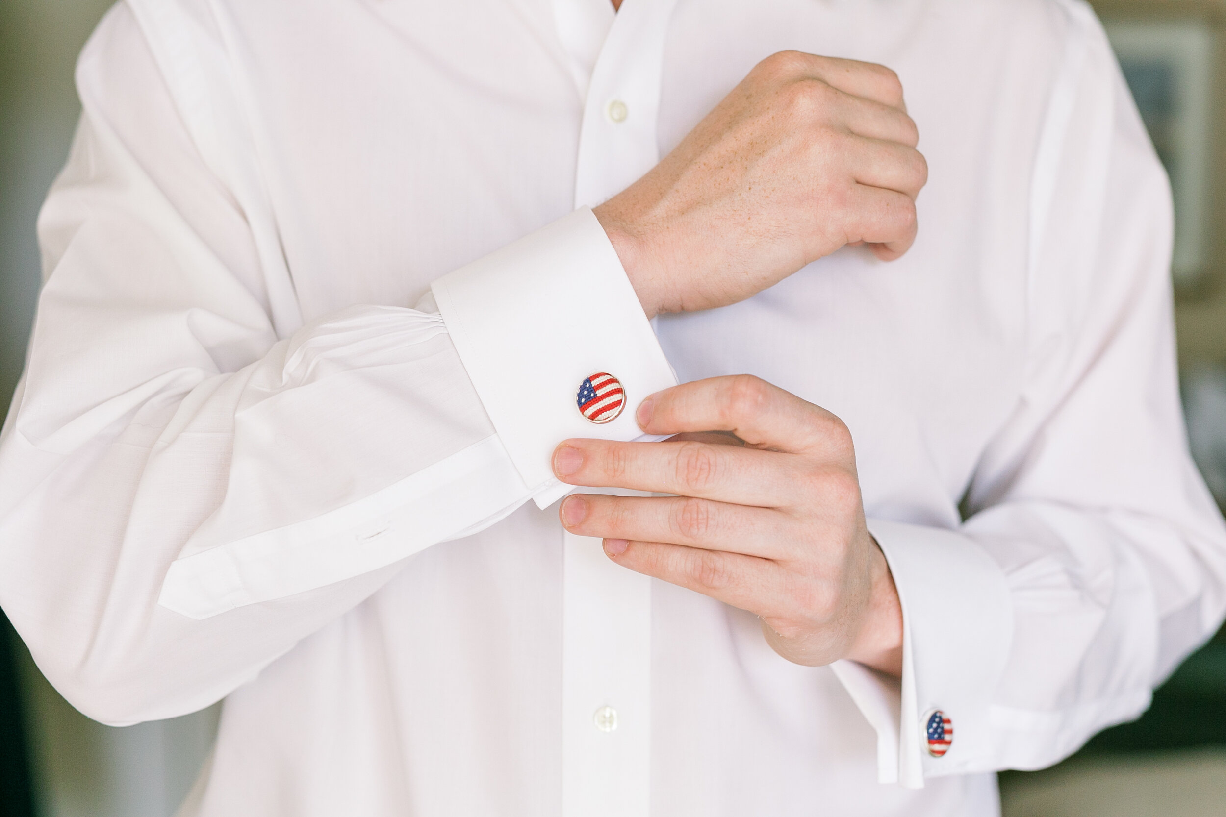 Groom’s getting ready details of custom-designed American flag cufflinks for Hilton Head Wedding.