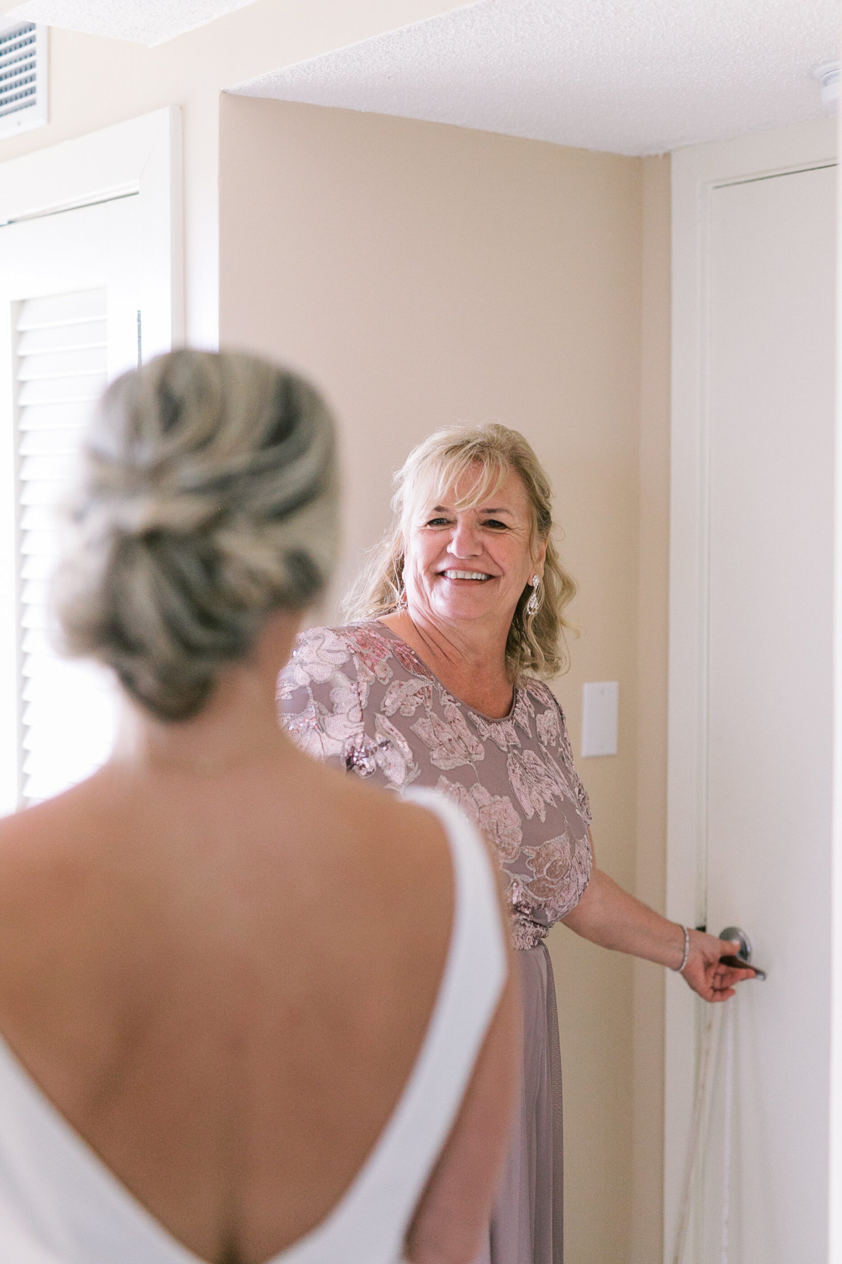 Mother of the bride glows seeing her daughter ready for her wedding in Hilton Head Island, South Carolina.