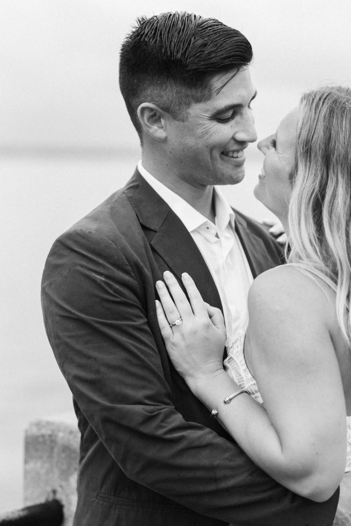 Stunning couple poses for joyful engagement photos in Charleston