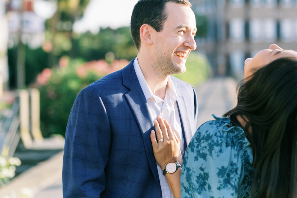 Joyful couple shares sweet moment during engagement photos in Charleston