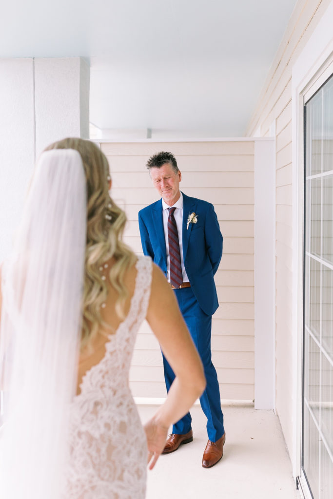 Sweet moment between bride and father on Charleston wedding day