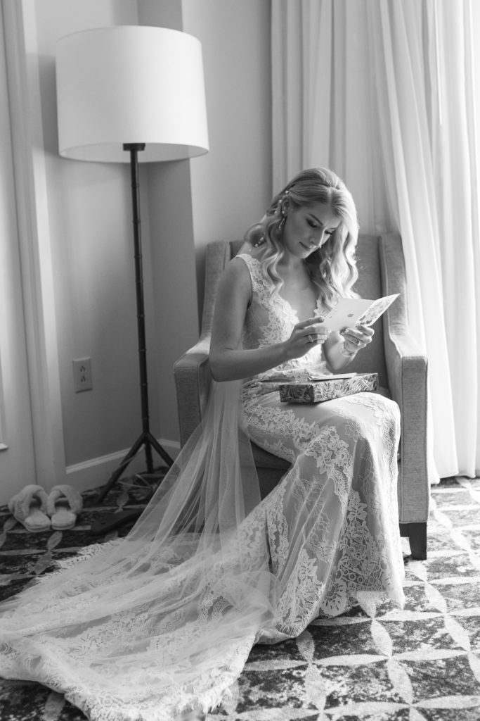 Bride reads note from groom on her Charleston wedding day