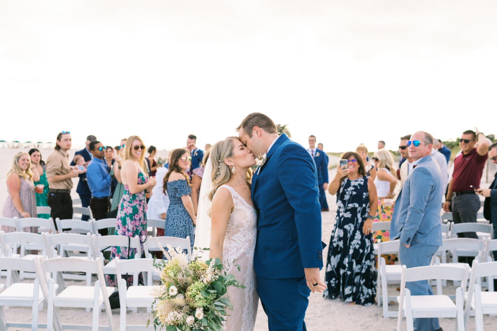 Aisle kiss of Charleston bride and groom at Wild Dunes Resort