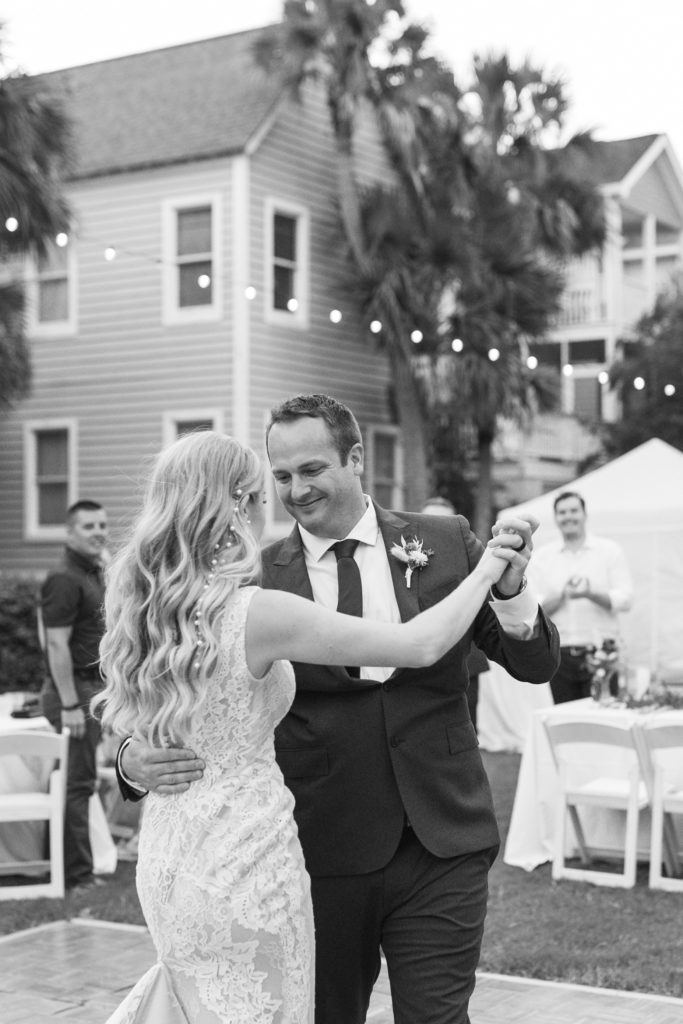 Candid groom during first dance at stunning Charleston wedding