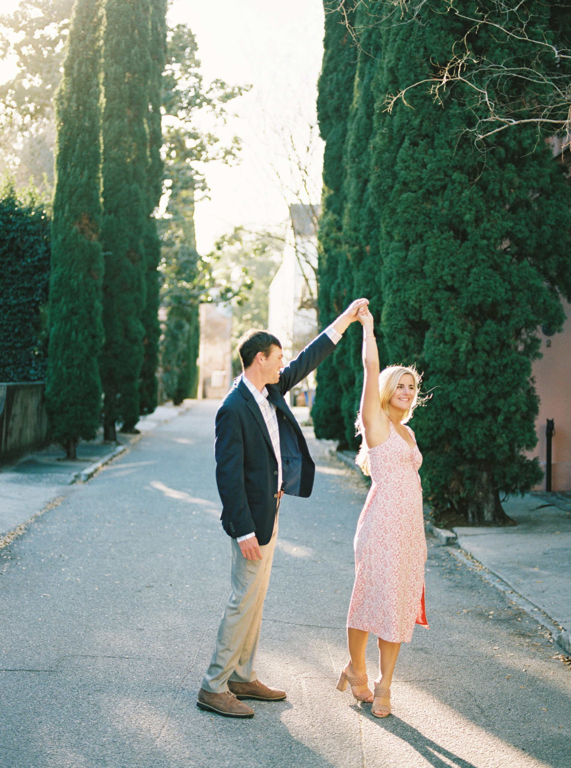 Sweet couple in Charleston dances for engagement portraits