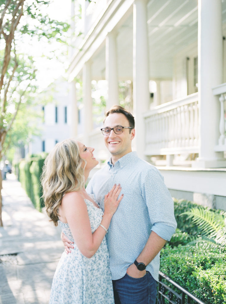 Grooms looks at camera in Charleston spring engagement photos