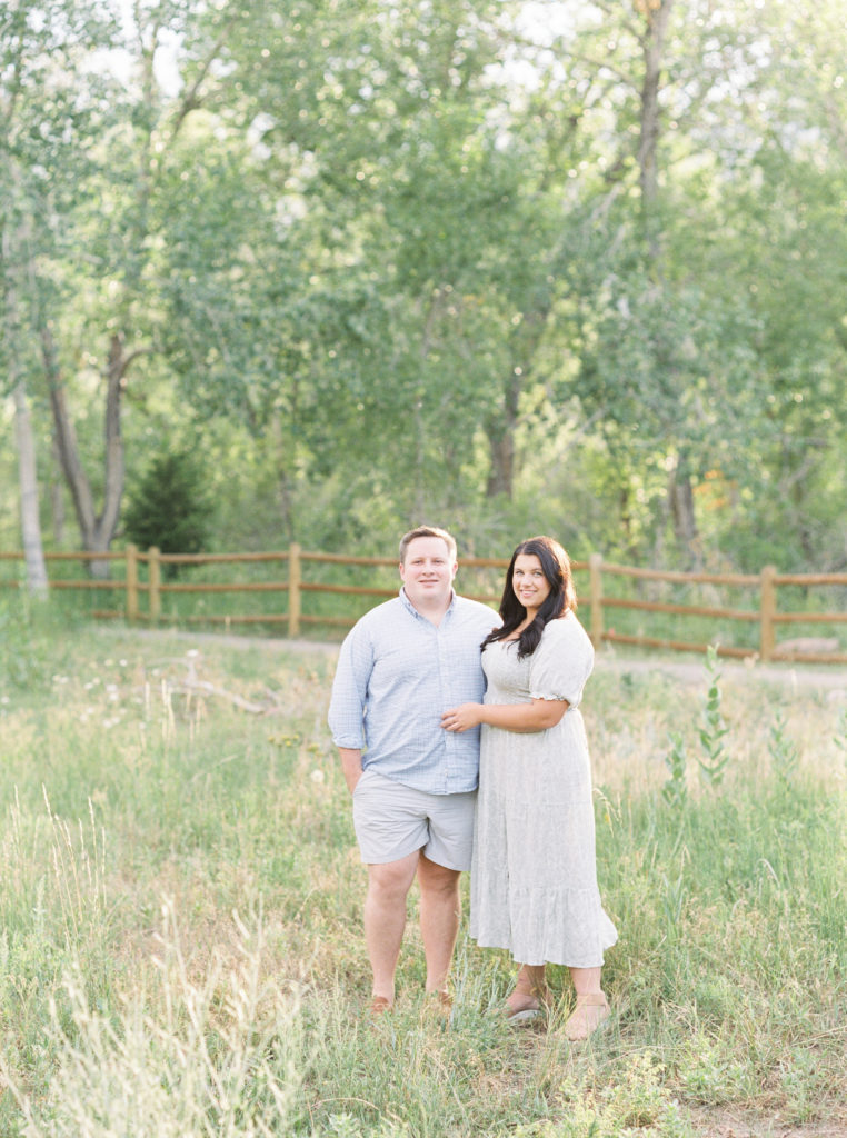 Boulder engagement photographer captures couple at sunset with aspen trees