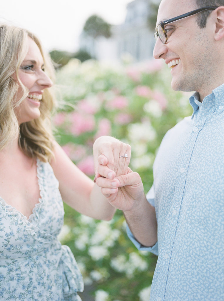Film wedding photographer documents square cut engagement ring during engagement pictures in Charleston