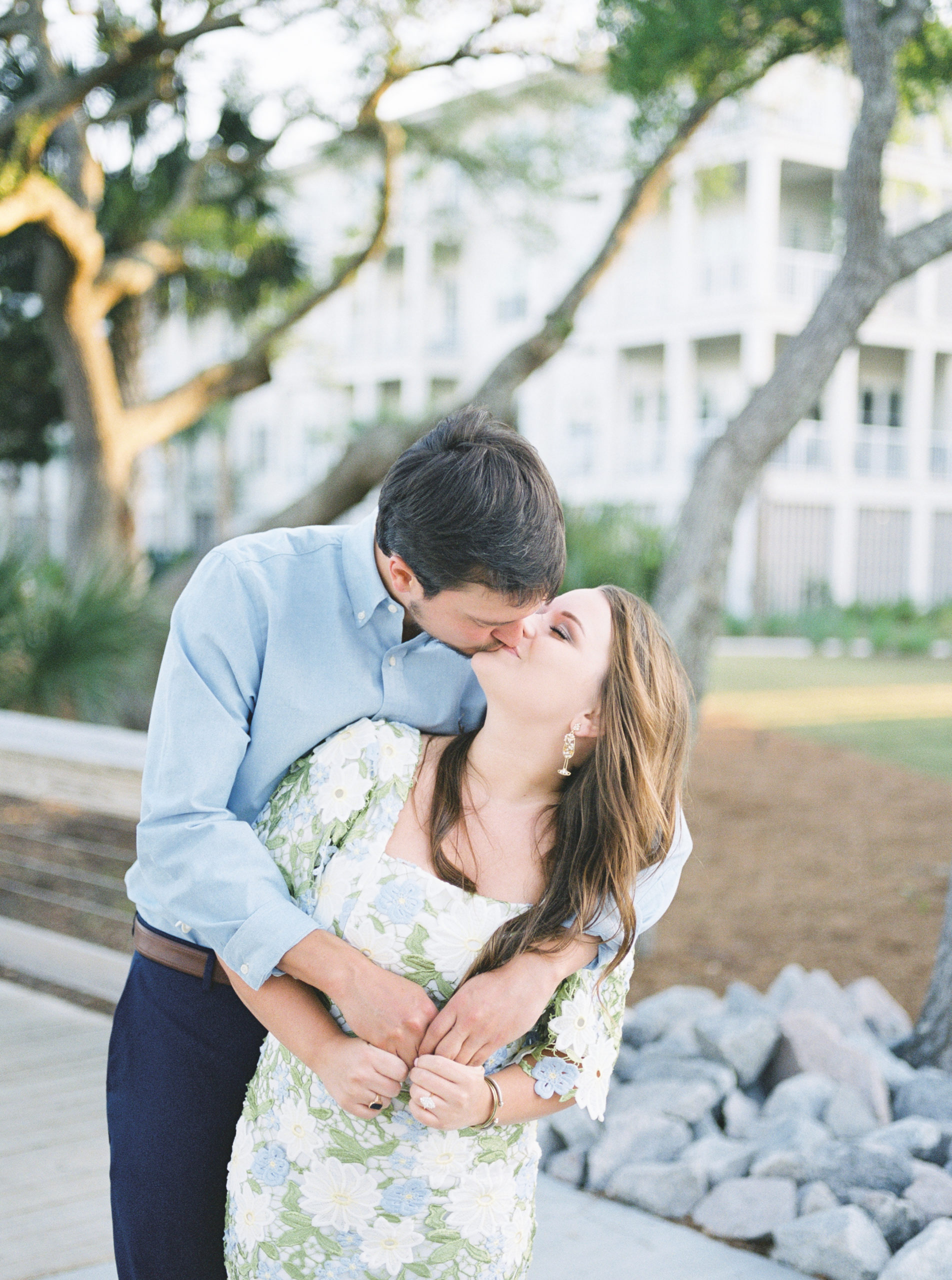 Engaged couple shares a kiss during Charleston Harbour engagement photos