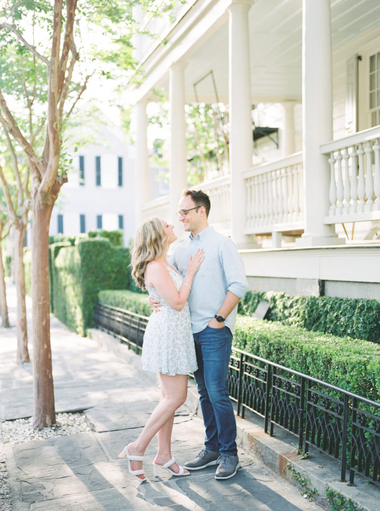Attractive couple in springtime Charleston engagement pictures in the historic French Quarter