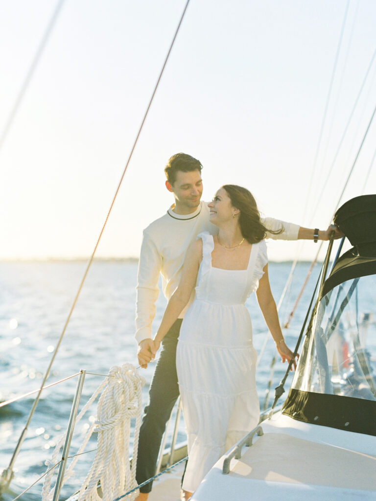 Charleston engagement photos on a sailboat