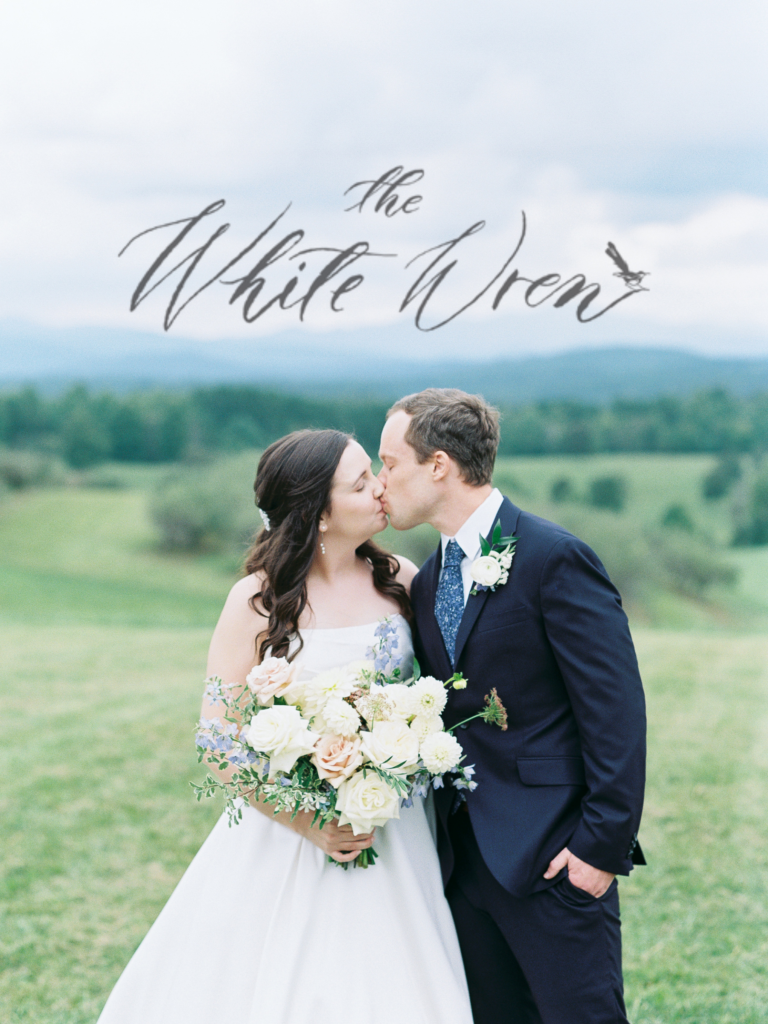 Couple kisses for portrait at Chattooga Belle Farms wedding