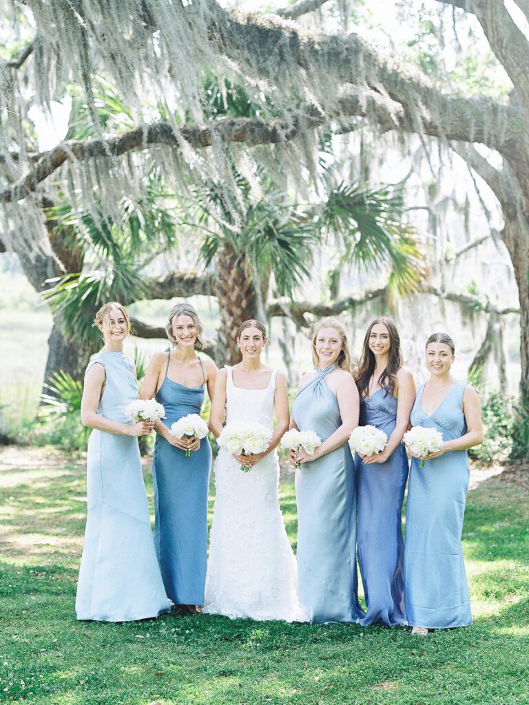 Bridesmaids in Mismatched Blue Dresses at the Dunlin Kiawah River