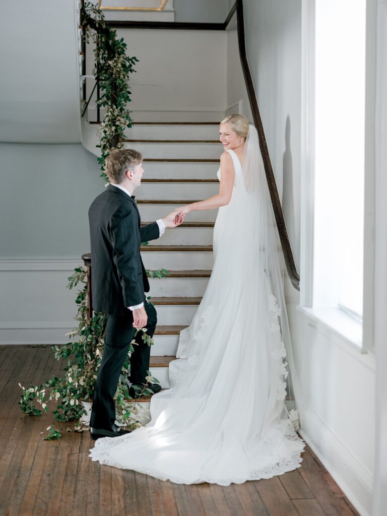 Bride and groom portrait on staircase inside the Gadsden House in Charleston SC