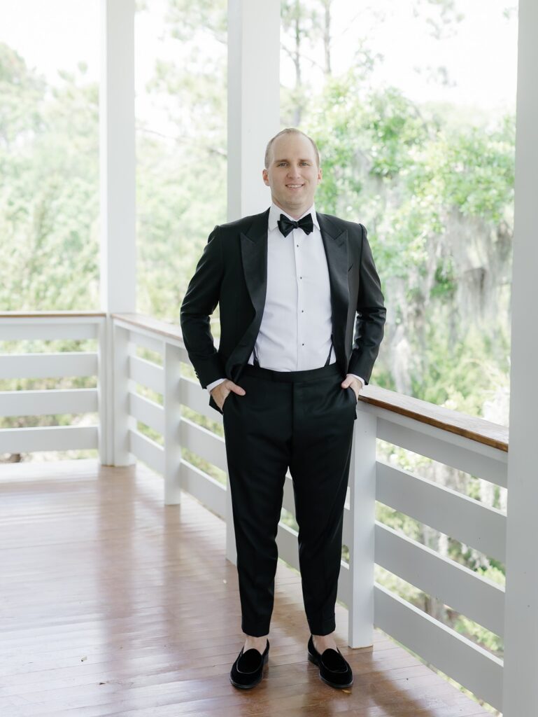 Groom getting ready at a private Kiawah River residence on wedding day