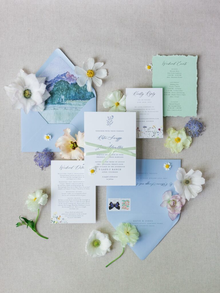 Custom watercolor invitations featuring Pyramid Peak at T Lazy 7 Ranch