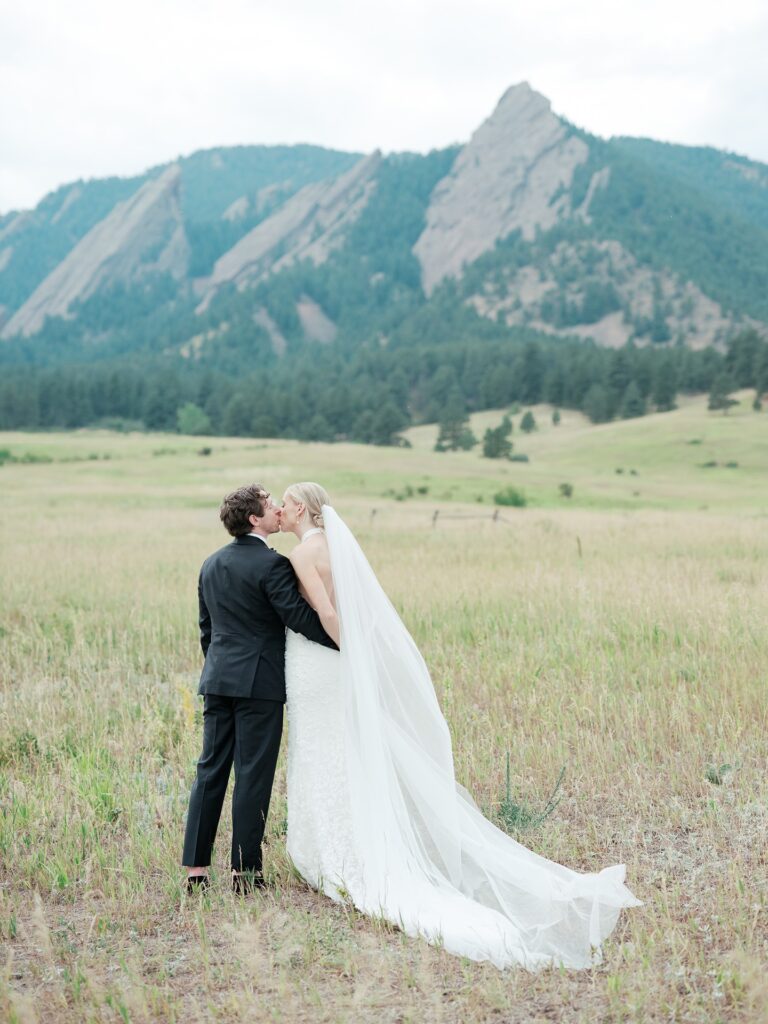 Bride and groom portraits during a St Julien Boulder wedding with the Flatirons in the background